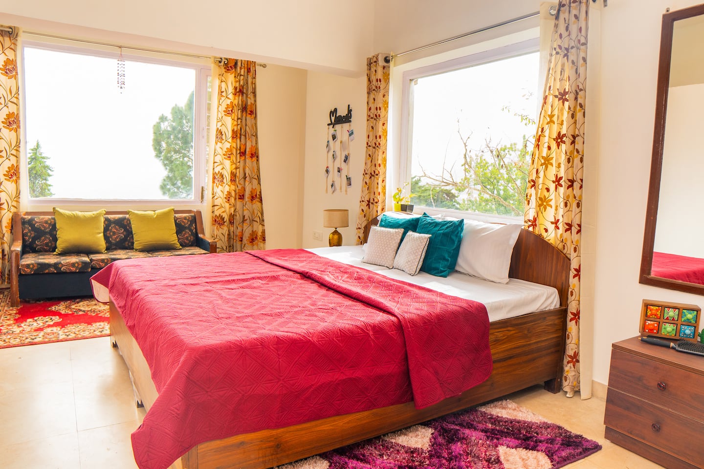 First floor bedroom with double bed and two large hill-facing windows